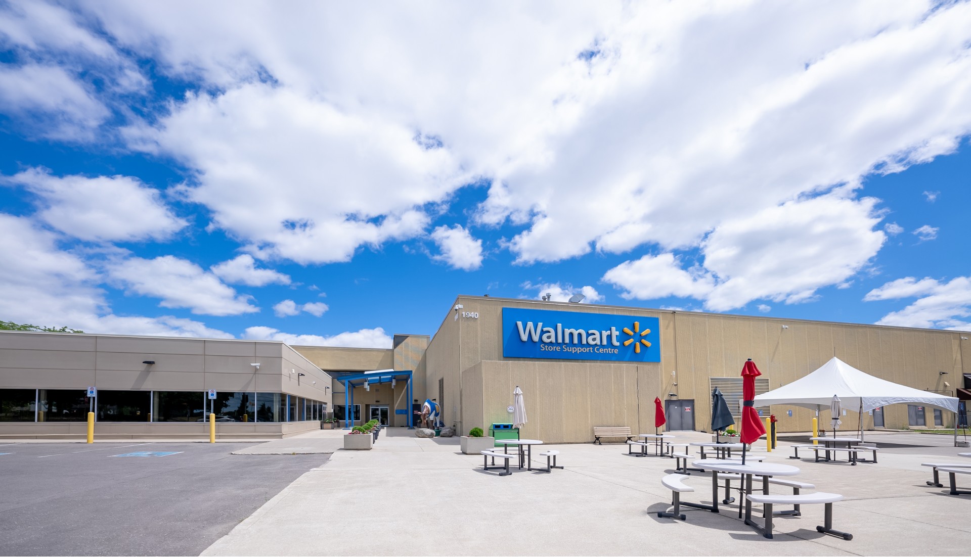 Exterior of a Walmart Support Center building on a sunny day.