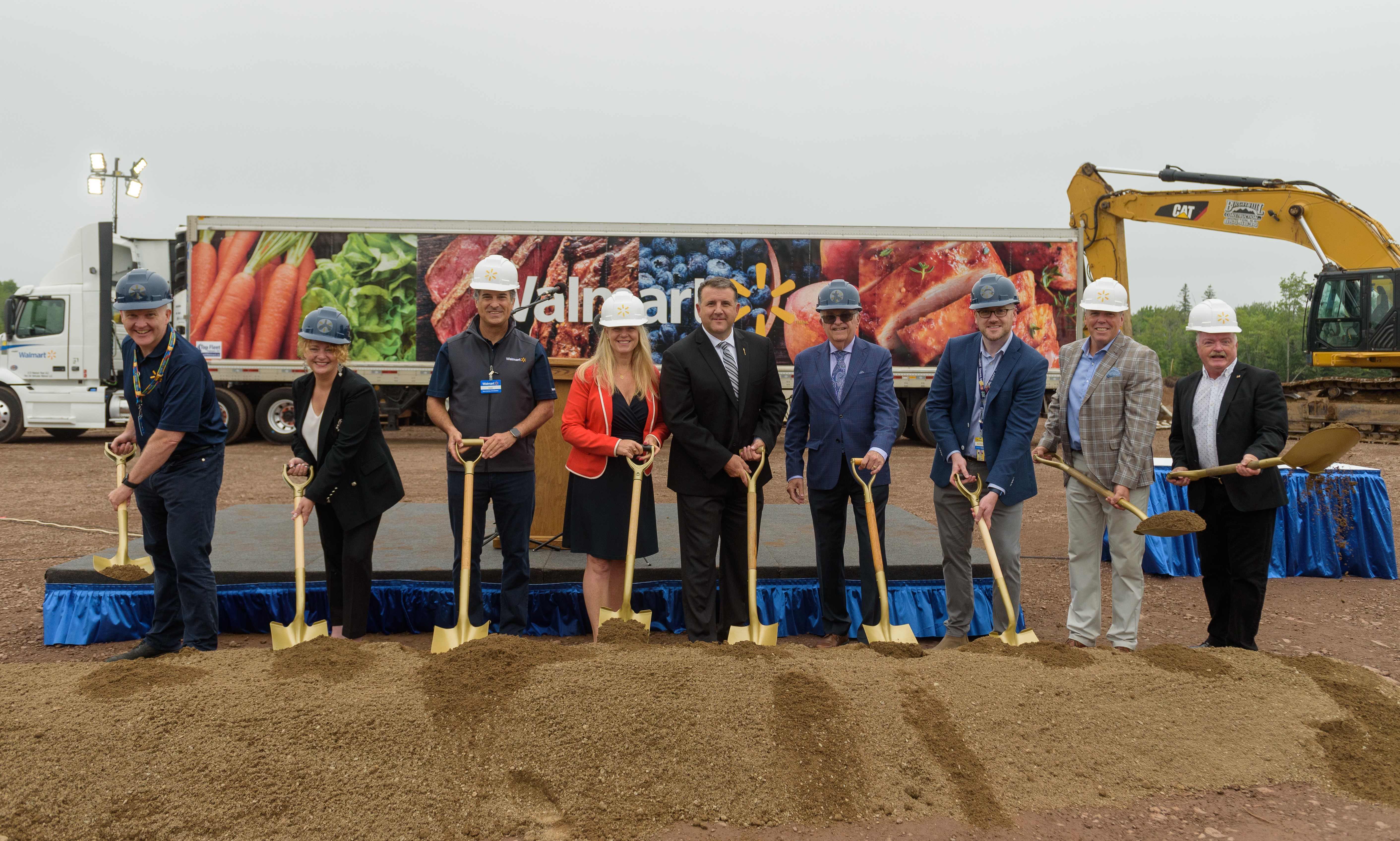 From left to right, Walmart Canada Executive Vice President, Transformation Officer John Bayliss, New Brunswick Economic Development Minister Arlene Dunn, Walmart Canada President and CEO Horacio Barbeito, Moncton Mayor Dawn Arnold, New Brunswick Local Government Minister Daniel Allain, Moncton Councillor at Large Greg Turner, Walmart Canada Chief Merchandising Officer Kieran Shanahan, New Brunswick Finance Minister Ernie Steeves and New Brunswick Social Development Minister Bruce Fitch.