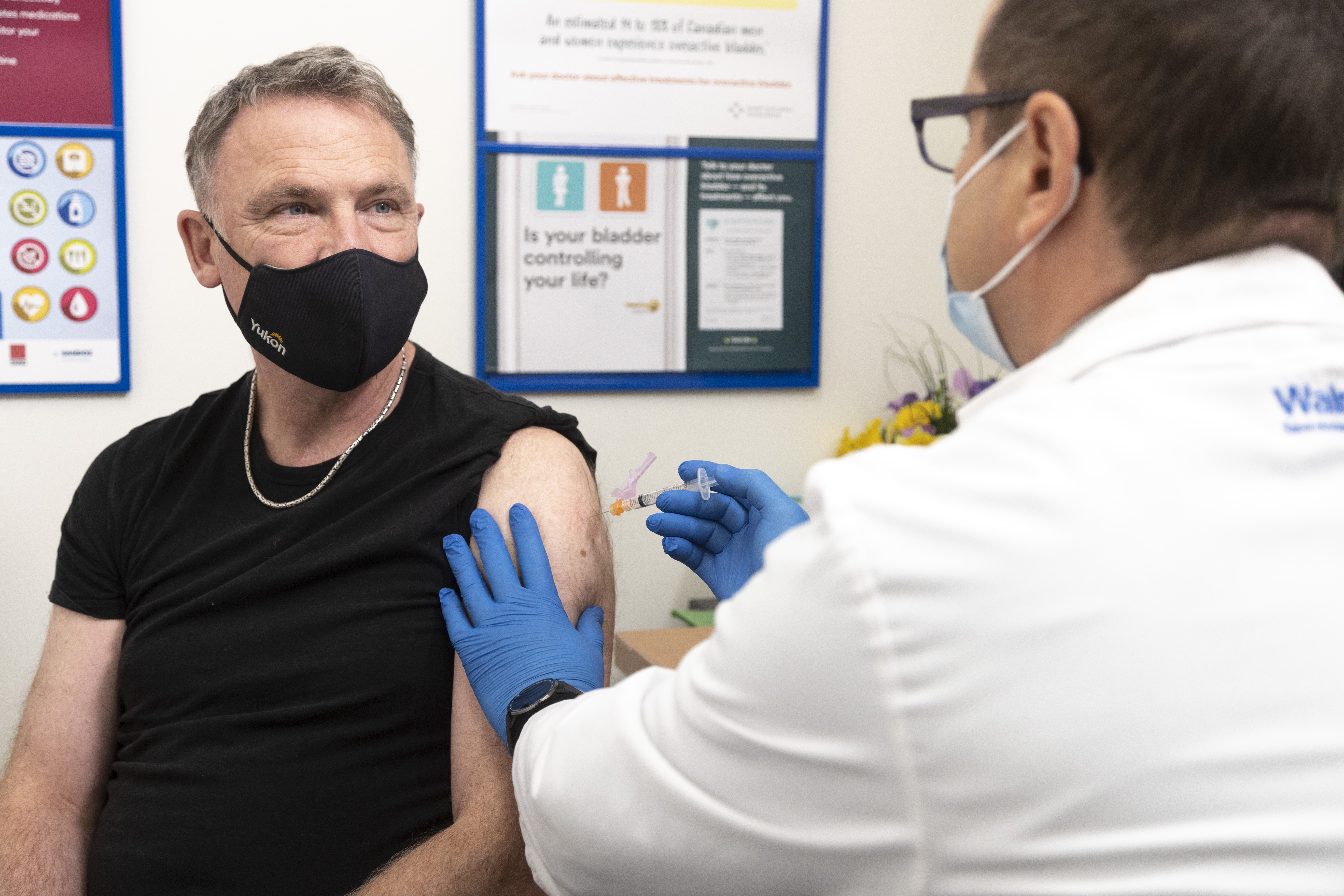 The Honourable Richard Mostyn, Yukon Minister of Community Services, receiving his flu shot in Whitehorse.